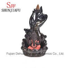 Ceramic Ganesh Incense Burner Sitting on The Lotus Stage
